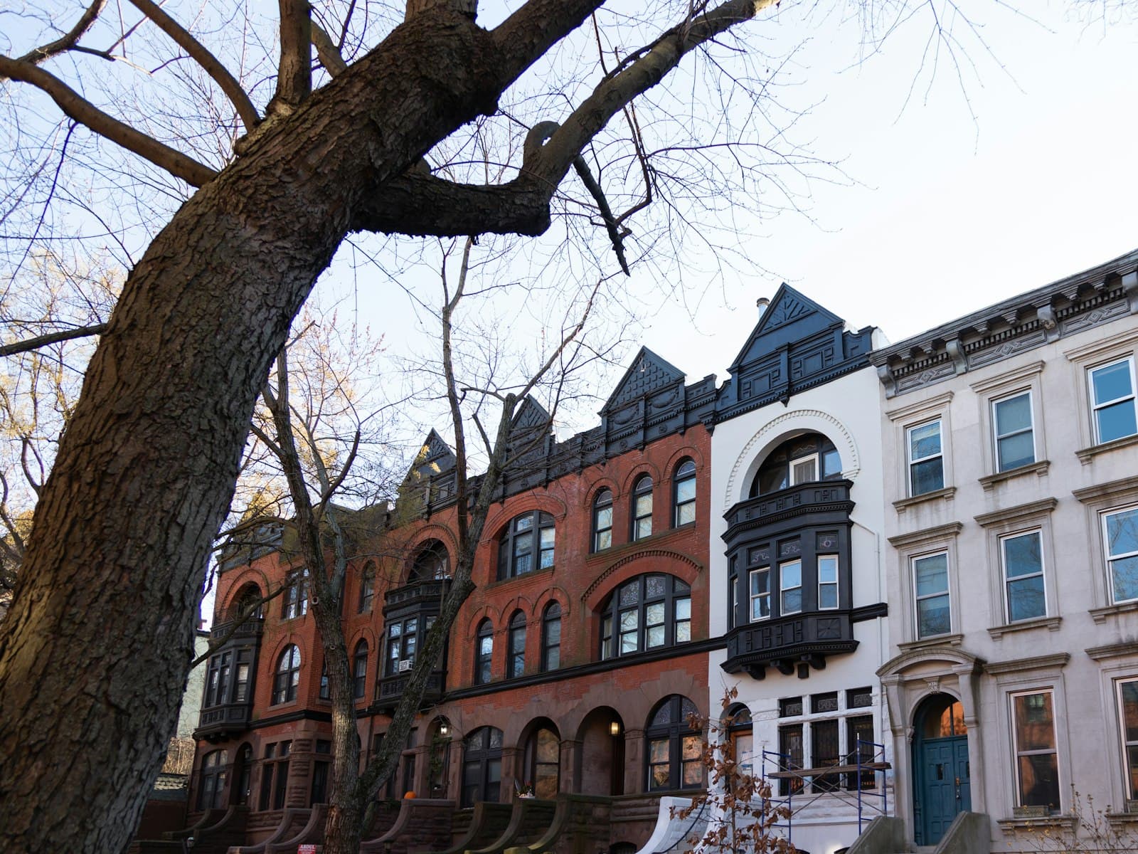 Brick and masonry rowhouses typical of the pre-war housing we service in northern New Jersey (stock photo, not a specific street)